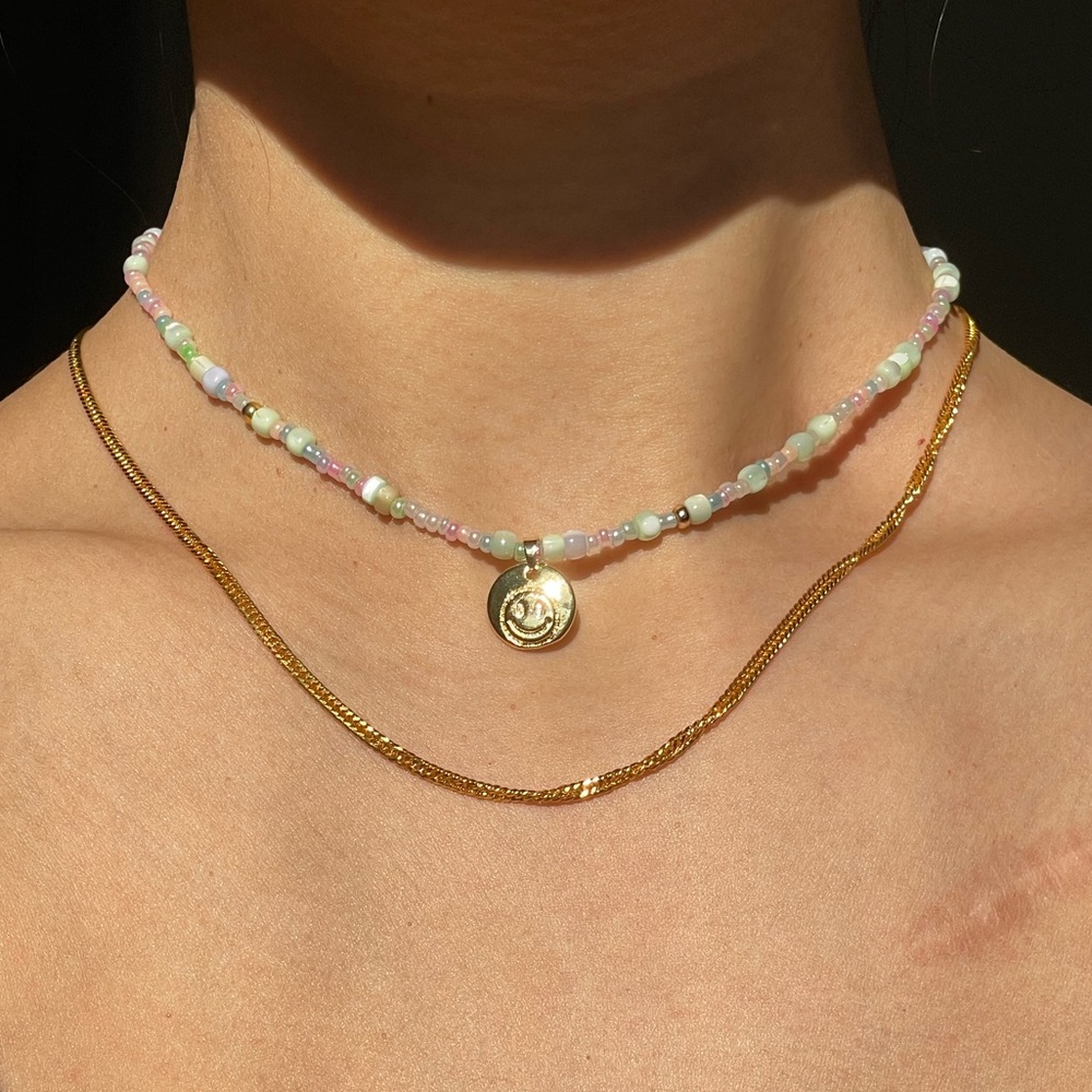 Beaded necklace with smiley face charm